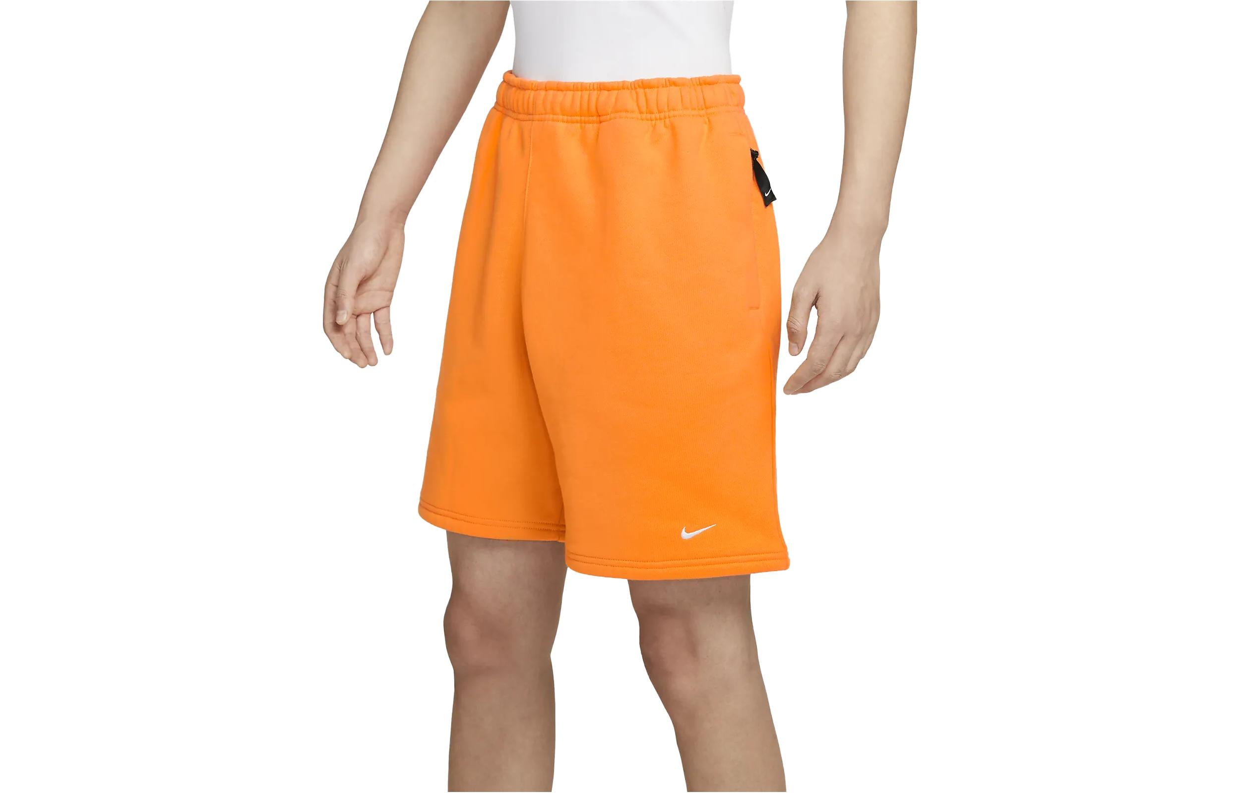 Image of شورت Nike Solo Swoosh Fleece باللون البرتقالي DV3056-836