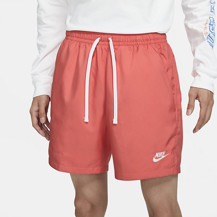 Image of شورت Nike NSW Sportswear المنسوج باللون الوردي السلموني AR2383-814