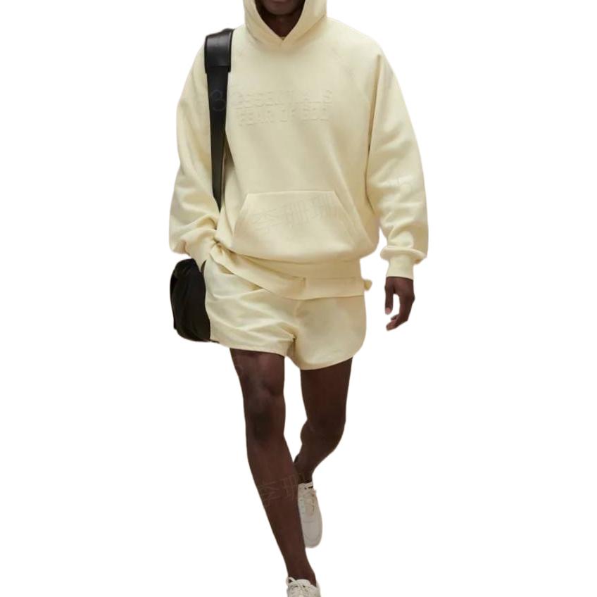 Image of Fear of God Essentials FW22 Running Shorts Canary FOG-FW22-557