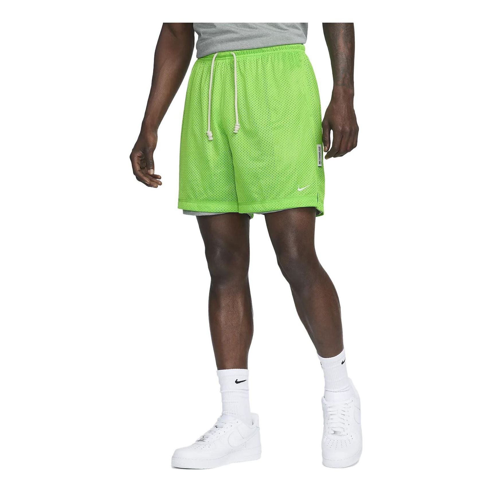 Image of Nike Dri-FIT Standard Issue Reversible Basketball Shorts 'Light Fluorescent Gree